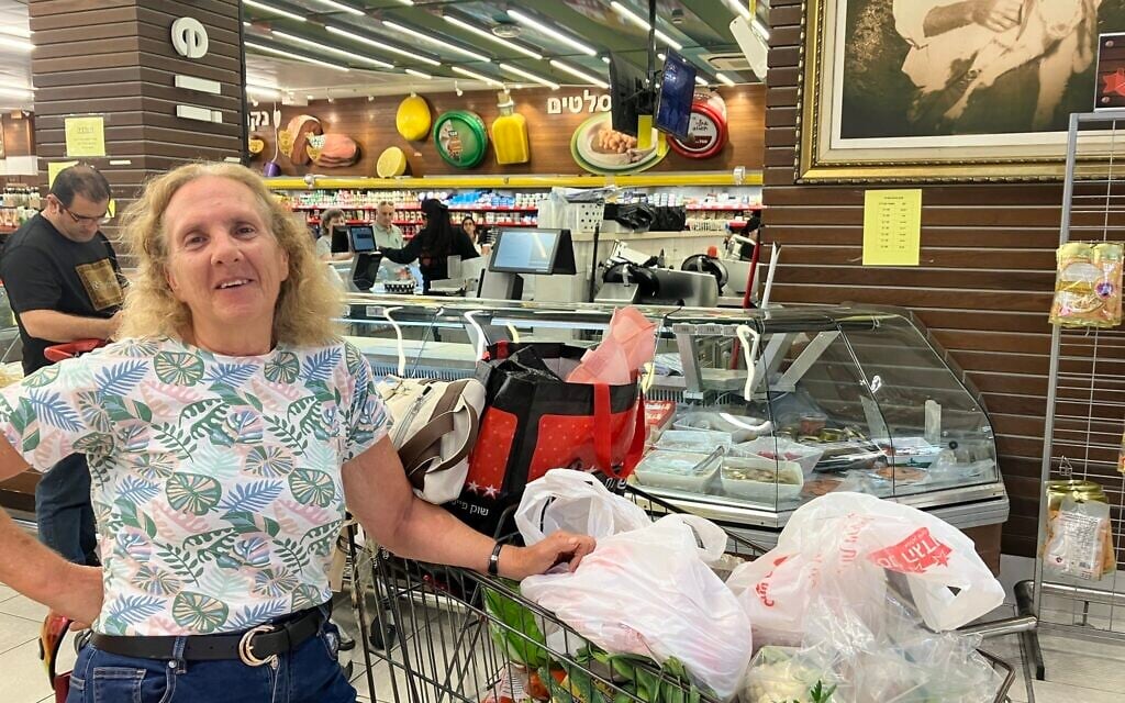 Ruti Reinhold shops at Souq Faisal in Mazra'a, outside of Nahariya, on June 8, 2026. (Diana Bletter/Times of Israel)