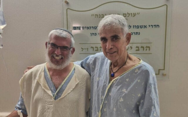 Yonatan Rom, left, who donated his kidney to Reuven Tam, right, recover together following the transplant at Clalit-Beilinson Hospital on July 14, 2026. Reuven's brother, Eyal Tam, saved Rom's life in a terrorist attack on March 7, 2002. (Courtesy/Clalit-Beilinson Hospital)