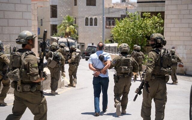 IDF troops of the Duvdevan Unit arrest a wanted Palestinian in the West Bank village of Mukhmas, June 2, 2026. (Israel Defense Forces) IDF troops of the Duvdevan Unit arrest a wanted Palestinian in the West Bank village of Mukhmas, June 2, 2026. (Israel Defense Forces)