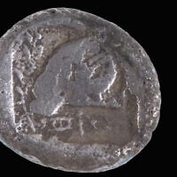 The 2,500-year-old coin from Cyprus discovered in Ashdod (Shai Halevi/Israel Antiquities Authority)