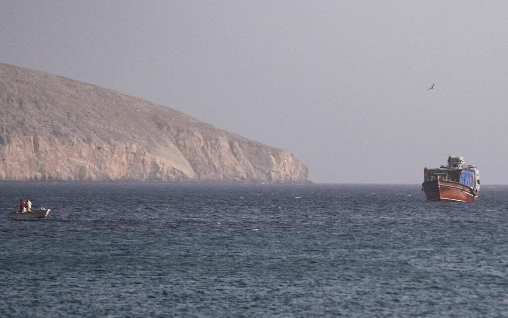 A vessel in the Strait of Hormuz, as seen from Musandam, Oman, July 16, 2026. (Stringer/Reuters)