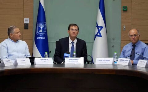 From left: Shin Bet head David Zini, Likud MK and Knesset Foreign Affairs and Defense Committee Chairman Boaz Bismuth, Central Elections Committee chair and Deputy Supreme Court President Noam Sohlberg, July 27, 2026. (Kan screenshot via YouTube)