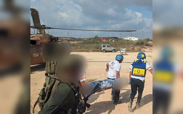 Medics and soldiers evacuate a person wounded in a shooting incident in the West Bank on  on July 24, 2026 (Magen David Adom)