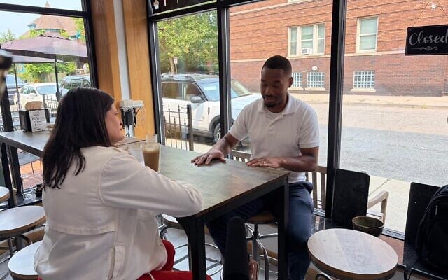 US Rep. Haley Stevens (l), candidate for the Democratic Senate nomination in Michigan, discusses Israel with Jai Singletary, director of a Detroit neighborhood improvement association, in Detroit, Michigan, July 27, 2026. (Andrew Lapin/JTA)