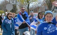 Milwaukee Jews march in the community's annual Walk for Israel, part of the federation's celebrations for Israel's independence day. (Courtesy of the Milwaukee Jewish Federation via JTA)