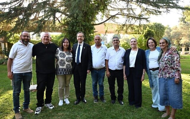 President Isaac Herzog and First Lady Michal Herzog host survivors and bereaved families from Kibbutz Kerem Shalom, at the President's Residence in Jerusalem, July 2, 2026 (Haim Zach/GPO)