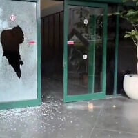 The entrance to the Channel 12 office in Tel Aviv after an attacker launched a brick at it overnight, on July 5, 2026. (Screenshot: X, used in accordance with Clause 27a of the Copyright Law)
