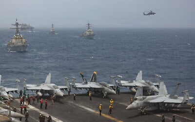 US Navy warships and aircraft transit the Arabian Sea in close formation, in a photo released July 8, 2026. (US Navy photo) US Navy warships and aircraft transit the Arabian Sea in close formation, in a photo released July 8, 2026. (US Navy photo)