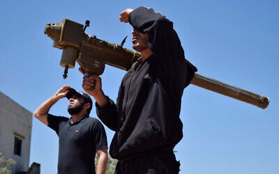 Illustrative: Rebel-fighters monitor the sky holding a FN-6 man-portable air-defence system (MANPADS) in the Syrian village of Teir Maalah, on the northern outskirts of Homs, on April 20, 2016. (MAHMOUD TAHA/AFP) Illustrative: Rebel-fighters monitor the sky holding a FN-6 man-portable air-defence system (MANPADS) in the Syrian village of Teir Maalah, on the northern outskirts of Homs, on April 20, 2016. (MAHMOUD TAHA/AFP)