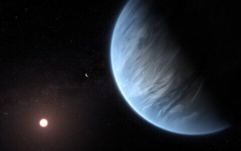 Illustrative: An artist’s impression of an exoplanet orbiting its star (M. KORNMESSER/ESA/Hubble/AFP)