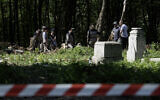 Polish archaeologists work at the exhumation site of the World War II Volhynia massacre near the destroyed village of Puzniki, Ternopil region, Western Ukraine, on April 25, 2025. (Vladyslav Musiienko / AFP)