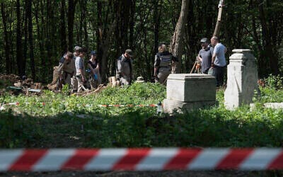 Polish archaeologists work at the exhumation site of the World War II Volhynia massacre near the destroyed village of Puzniki, Ternopil region, Western Ukraine, on April 25, 2025. (Vladyslav Musiienko / AFP) Polish archaeologists work at the exhumation site of the World War II Volhynia massacre near the destroyed village of Puzniki, Ternopil region, Western Ukraine, on April 25, 2025. (Vladyslav Musiienko / AFP)