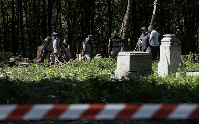 Polish archaeologists work at the exhumation site of the World War II Volhynia massacre near the destroyed village of Puzniki, Ternopil region, Western Ukraine, on April 25, 2025. (Vladyslav Musiienko / AFP) Polish archaeologists work at the exhumation site of the World War II Volhynia massacre near the destroyed village of Puzniki, Ternopil region, Western Ukraine, on April 25, 2025. (Vladyslav Musiienko / AFP)
