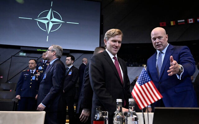 US Under Secretary of War for Policy, Elbridge Colby (L) speaks to US Ambassador to NATO nominee Matthew Whitaker as they take part in a meeting of NATO Ministers of Defence Summit at the NATO headquarters in Brussels on February 12, 2026. (Photo by JOHN THYS / AFP) US Under Secretary of War for Policy, Elbridge Colby (L) speaks to US Ambassador to NATO nominee Matthew Whitaker as they take part in a meeting of NATO Ministers of Defence Summit at the NATO headquarters in Brussels on February 12, 2026. (Photo by JOHN THYS / AFP)