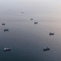 This aerial photograph shows boats anchored off Oman's northern Musandam Peninsula near the Strait of Hormuz on June 27, 2026. (AFP)