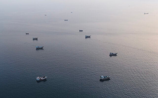 This aerial photograph shows boats anchored off Oman's northern Musandam Peninsula near the Strait of Hormuz on June 27, 2026. (AFP)
