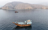 This aerial photograph shows boats anchored off Oman's northern Musandam Peninsula near the Strait of Hormuz on June 27, 2026 (AFP)