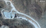 This handout satellite image courtesy of Vantor shows vehicles at the western entrance of the Pickaxe Mountain tunnel complex adjacent to the Natanz Nuclear Facility near Natanz, Isfahan province, central Iran, on June 21, 2026. (Satellite image ©2026 Vantor/AFP)