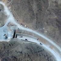 This handout satellite image courtesy of Vantor shows vehicles at the western entrance of the Pickaxe Mountain tunnel complex adjacent to the Natanz Nuclear Facility near Natanz, Isfahan province, central Iran, on June 21, 2026. (Satellite image ©2026 Vantor/AFP)