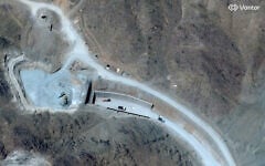 This handout satellite image courtesy of Vantor shows vehicles at the western entrance of the Pickaxe Mountain tunnel complex adjacent to the Natanz Nuclear Facility near Natanz, Isfahan province, central Iran, on June 21, 2026. (Satellite image ©2026 Vantor/AFP)