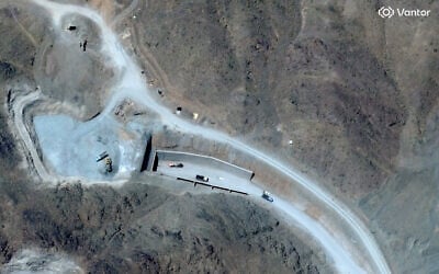 This handout satellite image courtesy of Vantor shows vehicles at the western entrance of the Pickaxe Mountain tunnel complex adjacent to the Natanz Nuclear Facility near Natanz, Isfahan province, central Iran, on June 21, 2026. (Satellite image ©2026 Vantor/AFP)