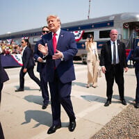 US President Donald Trump greets onlookers after arriving in a Freedom250-themed train ahead of a dedication ceremony for the Theodore Roosevelt Presidential Library on July 01, 2026 in Medora, North Dakota. (Andrew Harnik/Getty Images/AFP)