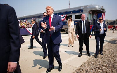 US President Donald Trump greets onlookers after arriving in a Freedom250-themed train ahead of a dedication ceremony for the Theodore Roosevelt Presidential Library on July 01, 2026 in Medora, North Dakota. (Andrew Harnik/Getty Images/AFP)