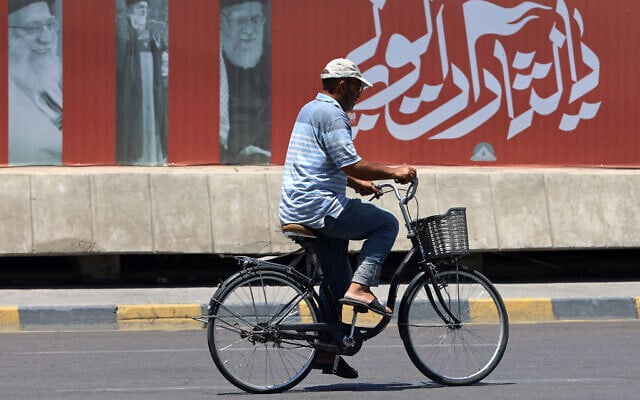 A cyclist rides past a billboard bearing pictures of Iran's late supreme leader Ayatollah Ali Khamenei, along a street in Baghdad on July 2, 2026, ahead of his funeral in Tehran. (Ahmad al-Rubate/AFP) A cyclist rides past a billboard bearing pictures of Iran's late supreme leader Ayatollah Ali Khamenei, along a street in Baghdad on July 2, 2026, ahead of his funeral in Tehran. (Ahmad al-Rubate/AFP)