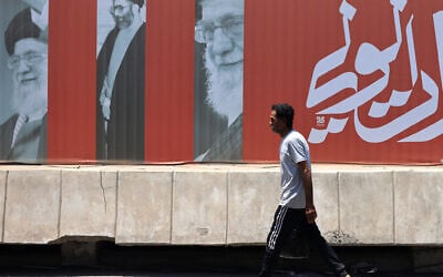 A commuter walks past a billboard bearing pictures of Iran's late supreme leader Ayatollah Ali Khamenei, along a street in Baghdad on July 2, 2026, ahead of his funeral in Tehran. (AHMAD AL-RUBAYE / AFP) A commuter walks past a billboard bearing pictures of Iran's late supreme leader Ayatollah Ali Khamenei, along a street in Baghdad on July 2, 2026, ahead of his funeral in Tehran. (AHMAD AL-RUBAYE / AFP)