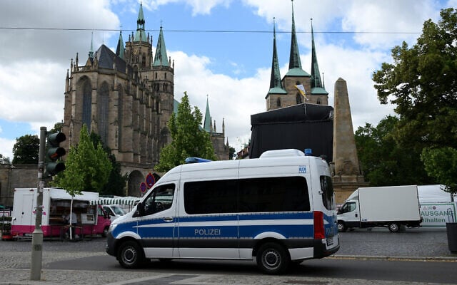 A police vehicle is seen near the Cathedral and St Severi Church in the central square in Erfurt, eastern Germany on July 3, 2026, ahead of the party congress of far-right Alternative for Germany (RALF HIRSCHBERGER / AFP)