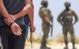 Israeli soldiers prevent Palestinian residents from the village of Qabalan, south of Nablus in the West Bank, from returning to their homes and lands after Israeli settlers, who had established an outpost on the village's land, prevented them from approaching, July 4, 2026. (Jaafar Ashtiyeh/AFP)