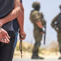 Israeli soldiers prevent Palestinian residents from the village of Qabalan, south of Nablus in the West Bank, from returning to their homes and lands after Israeli settlers, who had established an outpost on the village's land, prevented them from approaching, July 4, 2026. (Jaafar Ashtiyeh/AFP)