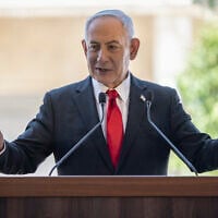 Prime Minister Benjamin Netanyahu speaks during a cornerstone laying ceremony for the Atarot Heritage Center at an abandoned airport in East Jerusalem on July 5, 2026. (ilia YEFIMOVICH / AFP)