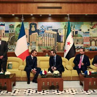France's President Emmanuel Macron (2nd L) speaks with Syria's Foreign Minister Asaad al-Shaibani (C-R) next to France's Foreign Affairs Minister Jean-Noel Barrot (L) during a bilateral meeting at the Damascus International Airport in Damascus on July 6, 2026. (Ludovic MARIN / AFP) France's President Emmanuel Macron (2nd L) speaks with Syria's Foreign Minister Asaad al-Shaibani (C-R) next to France's Foreign Affairs Minister Jean-Noel Barrot (L) during a bilateral meeting at the Damascus International Airport in Damascus on July 6, 2026. (Ludovic MARIN / AFP)