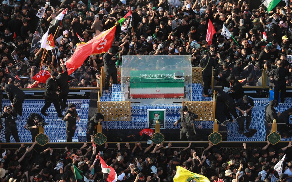 Crowds of mourners surround the convoy carrying the coffin of Iran's slain supreme leader Ali Khamenei during a funeral procession in Najaf, Iraq, on July 8, 2026. (Murtaja Lateef/AFP) Crowds of mourners surround the convoy carrying the coffin of Iran's slain supreme leader Ali Khamenei during a funeral procession in Najaf, Iraq, on July 8, 2026. (Murtaja Lateef/AFP)