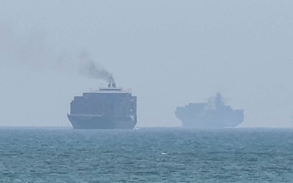 This frame grab taken from AFPTV video footage on July 12, 2026 shows cargo ships anchoring near the Strait of Hormuz off the eastern coast of the United Arab Emirates at Khor Fakkan (AFPTV/AFP) This frame grab taken from AFPTV video footage on July 12, 2026 shows cargo ships anchoring near the Strait of Hormuz off the eastern coast of the United Arab Emirates at Khor Fakkan (AFPTV/AFP)