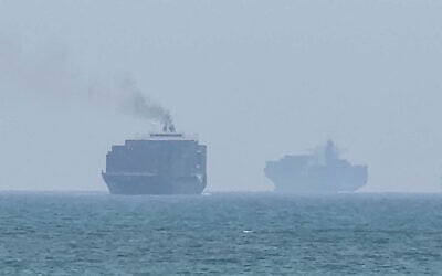 This frame grab taken from AFPTV video footage on July 12, 2026 shows cargo ships anchoring near the Strait of Hormuz off the eastern coast of the United Arab Emirates at Khor Fakkan (AFPTV/AFP) This frame grab taken from AFPTV video footage on July 12, 2026 shows cargo ships anchoring near the Strait of Hormuz off the eastern coast of the United Arab Emirates at Khor Fakkan (AFPTV/AFP)