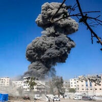 A smoke plume billows during an Israeli strike on an industrial area in Gaza City on July 12, 2026. (Omar AL-QATTAA/ AFP)