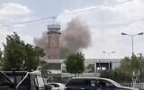 This screen grab taken from a video footage released by the Al-Masirah TV and made available via AFPTV on July 13, 2026, shows smoke rising from the airport in Sanaa (AL-MASIRAH TV/AFP)