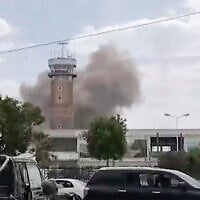 This screen grab taken from a video footage released by the Al-Masirah TV and made available via AFPTV on July 13, 2026, shows smoke rising from the airport in Sanaa (AL-MASIRAH TV/AFP)