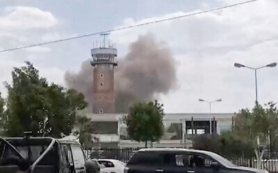 This screen grab taken from a video footage released by the Al-Masirah TV and made available via AFPTV on July 13, 2026, shows smoke rising from the airport in Sanaa (AL-MASIRAH TV/AFP)