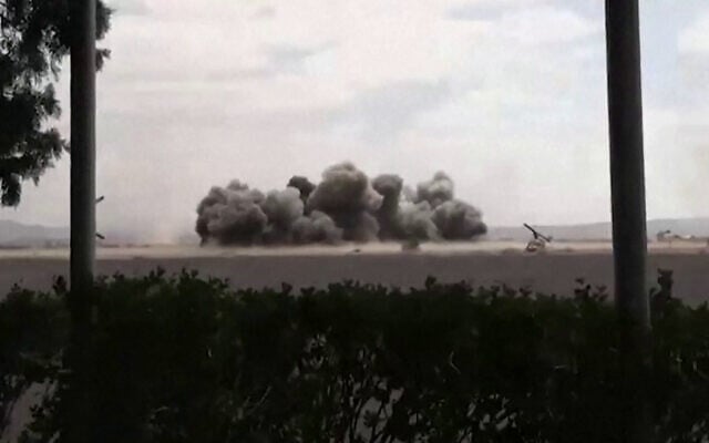This screen grab taken from video footage released by the Houthi rebels’ Al-Masirah TV channel and made available via AFPTV on July 13, 2026, shows airstrikes blamed on Saudi Arabia hitting Sanaa International Airport. (Al-Masirah/AFP)