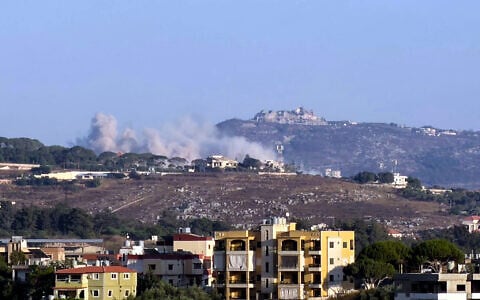 This photograph taken from the southern Lebanese city of Nabatieh shows smoke as it rises from the site of an Israeli-controlled explosion in the village of Kfar Tibnit, with the Beaufort citadel seen in the distance, on July 13, 2026 (Abbas FAKIH/AFP)