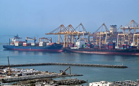 Ships are docked along a pier at the Khor Fakkan Container Terminal, the only natural deep-sea port in the region and one of the major container ports in Sharjah Emirate, along the Gulf of Oman on July 14, 2026 (AFP)
