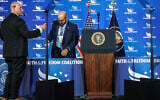 White House teleprompter operators, including Gabriel Perez (R) sets up a teleprompter before US President Donald Trump speaks at the Faith and Freedom Coalition’s 2026 Policy Conference at the Washington Hilton on June 26, 2026 in Washington, DC. (Anna Moneymaker/Getty Images/AFP)