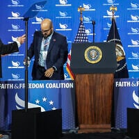 White House teleprompter operators, including Gabriel Perez (R) sets up a teleprompter before US President Donald Trump speaks at the Faith and Freedom Coalition’s 2026 Policy Conference at the Washington Hilton on June 26, 2026 in Washington, DC. (Anna Moneymaker/Getty Images/AFP)