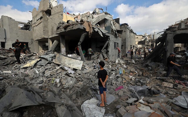 Palestinians inspect the site of an Israeli strike at the Bureij refugee camp in central Gaza Strip, on July 16, 2026. (Eyad Baba/AFP) Palestinians inspect the site of an Israeli strike at the Bureij refugee camp in central Gaza Strip, on July 16, 2026. (Eyad Baba/AFP)