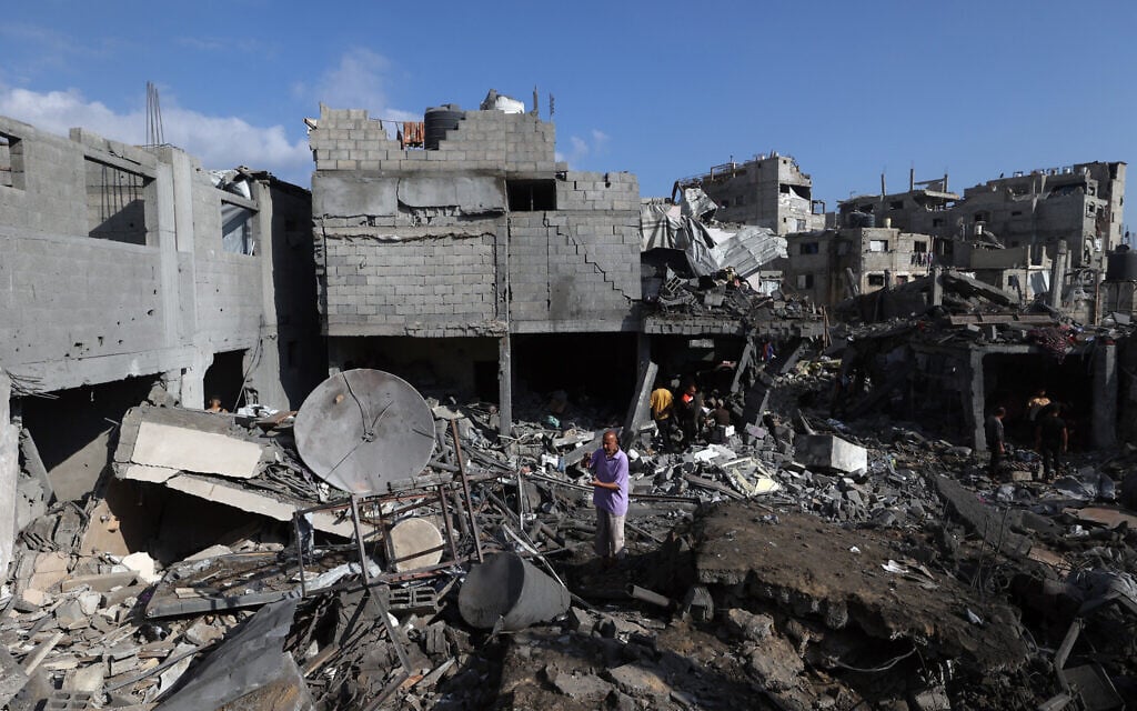 Palestinians inspect the site of an Israeli strike at the Bureij refugee camp in central Gaza Strip, on July 16, 2026. (Eyad Baba/AFP)