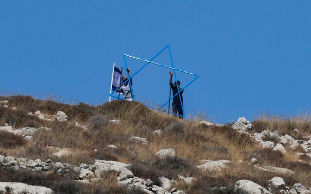 Israeli settlers build a new outpost at the Palestinian village of Azmut in the West Bank on July 17, 2026. (Jaafar ASHTIYEH/AFP)