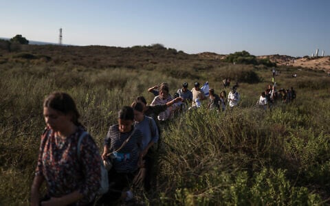 This picture taken from a position on the Israeli border with the Gaza Strip shows settler activists attempting to make their way into the Palestinian territory on July 19, 2026. (Ilia YEFIMOVICH/AFP)